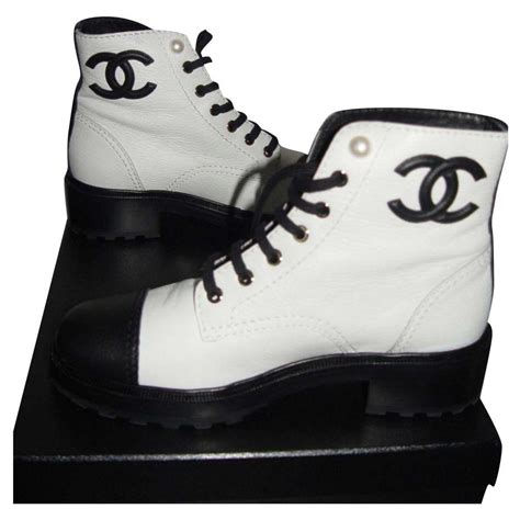 black and white chanel boots.